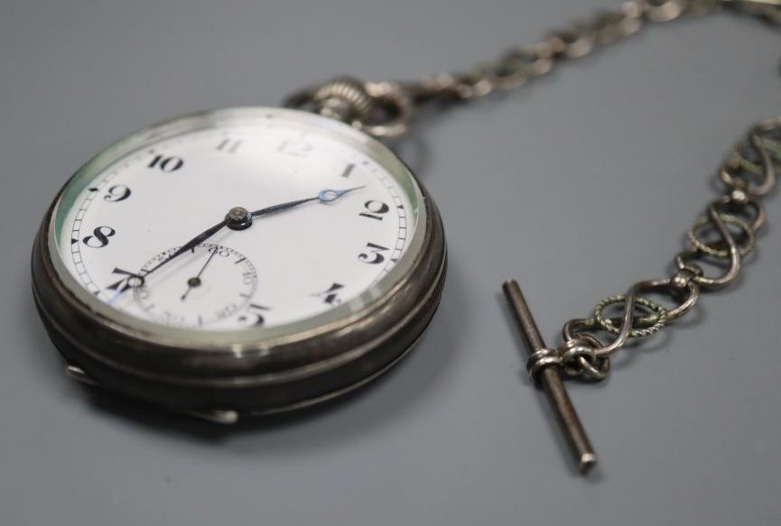 A 1920s silver open face Record keyless lever pocket watch, with a white metal albert, case diameter 48mm.